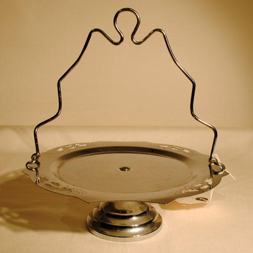 Probably from the 60 39s this unusual cake stand has a much more modern feel